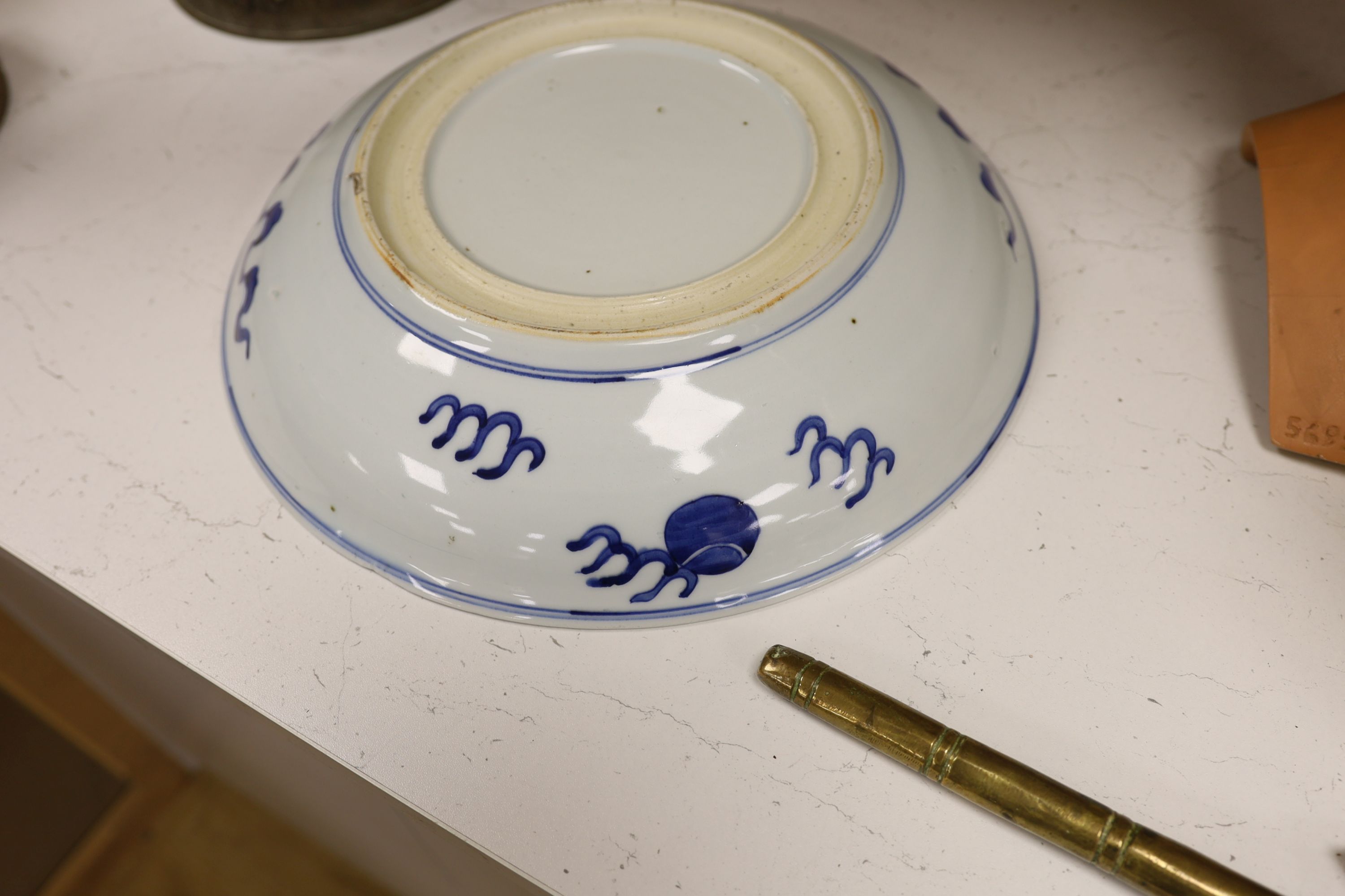A Chinese blue and white ‘Buddhist lion’ dish, channel moulded foot, 36cm diameter
